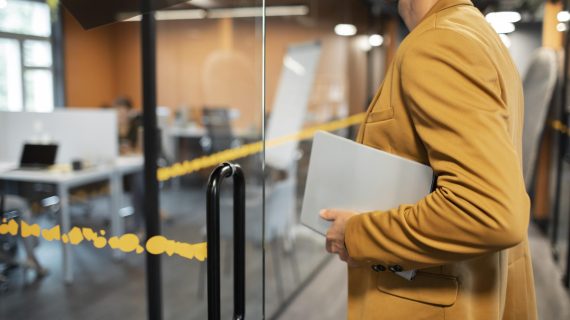 close-up-man-carrying-laptop